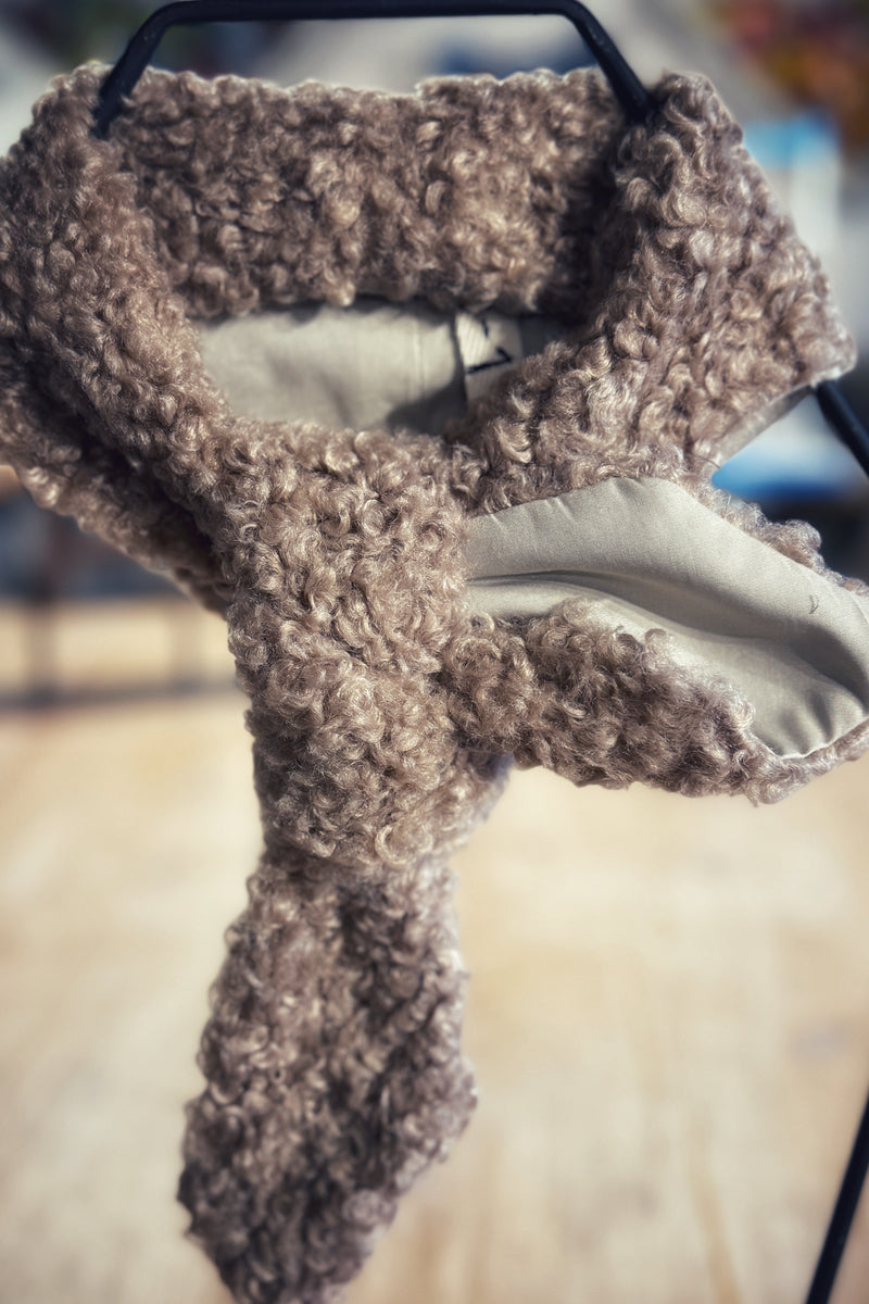 Beige wool scarf on trend 2026