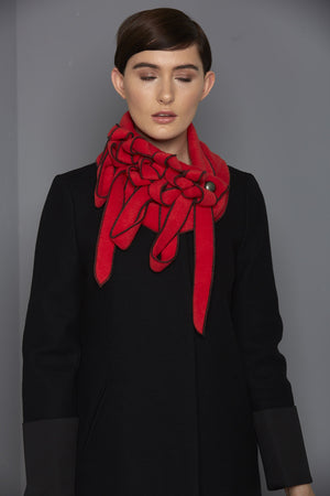 bright red scarf with black stitching
