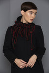 black scarf with red stitching